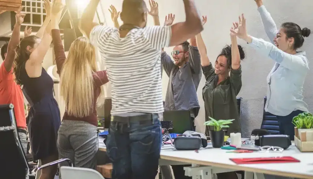 Young,Coworkers,Celebrating,New,Startup,Project,-,Happy,Teamwork,In