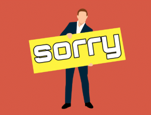 Man with sorry card